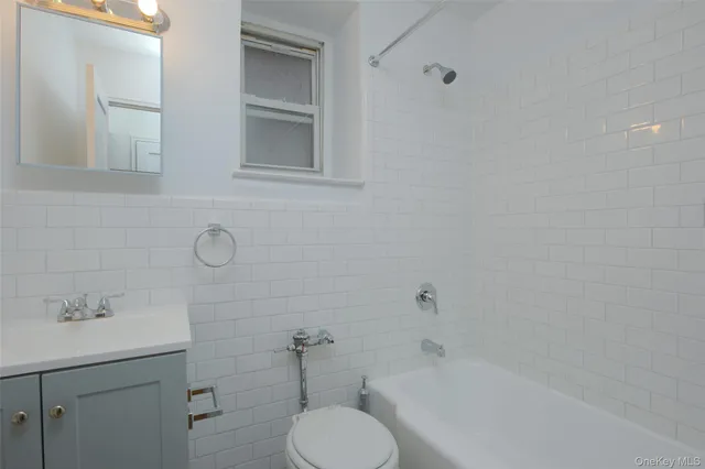 a bathroom with a sink toilet and bathtub