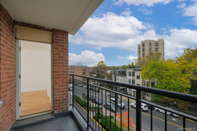 a view of a balcony with city view