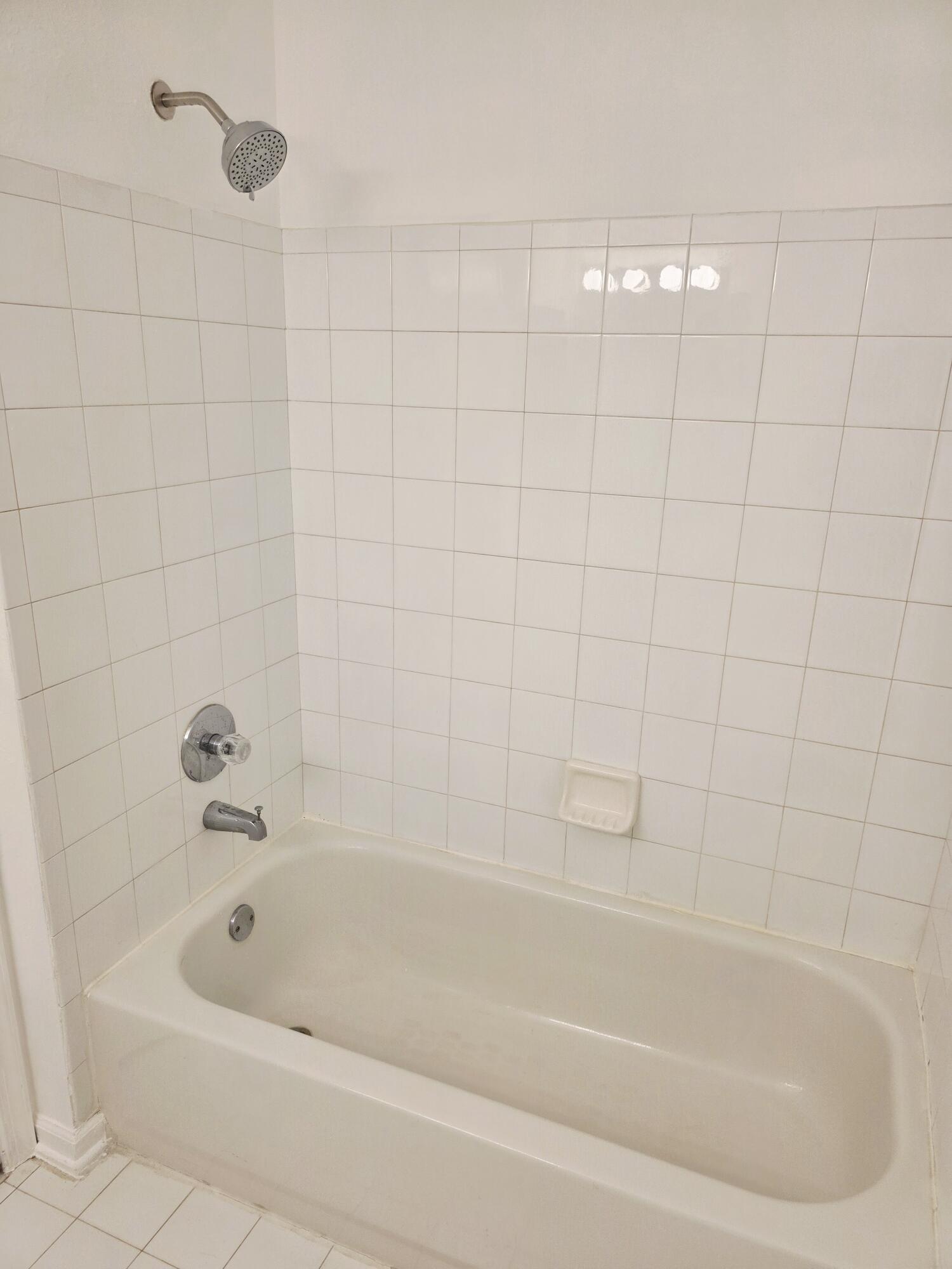 10851 Palm Ridge Lane Tamarac, FL 33321 - Photo 18 of 40 a bathroom with a bathtub