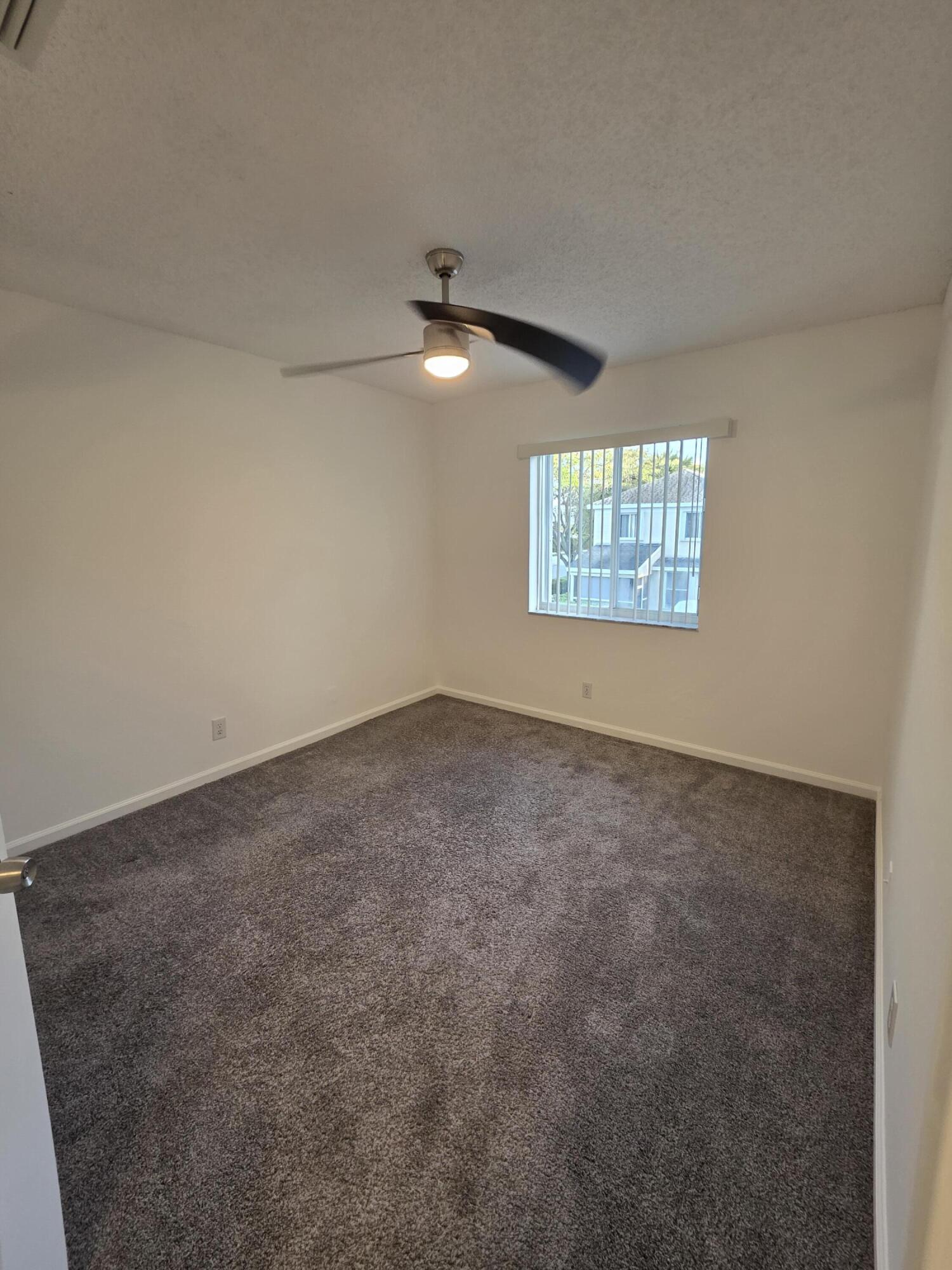 10851 Palm Ridge Lane Tamarac, FL 33321 - Photo 19 of 40 an empty room with a window