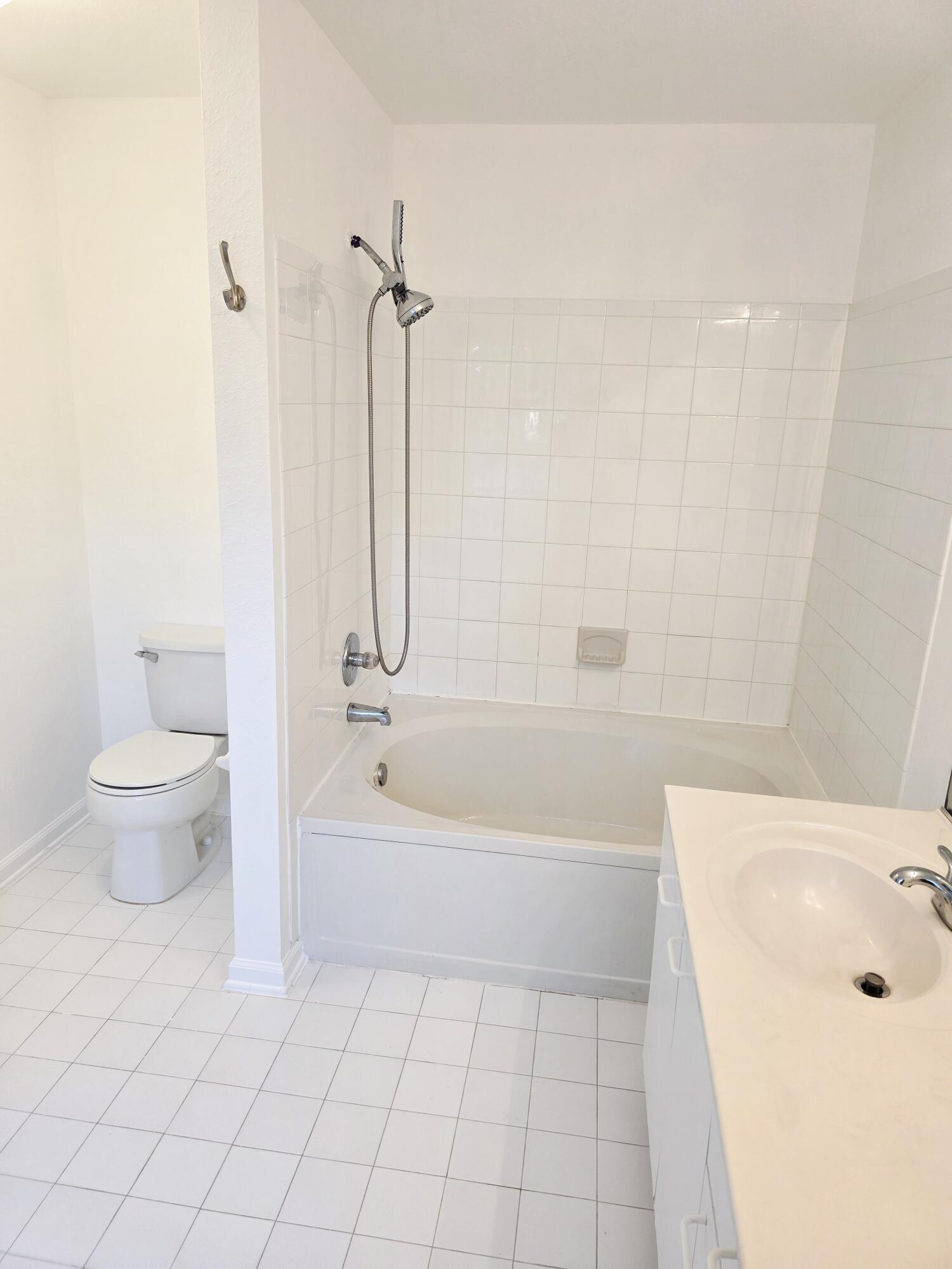 10851 Palm Ridge Lane Tamarac, FL 33321 - Photo 24 of 40 a bathroom with a bathtub and a toilet