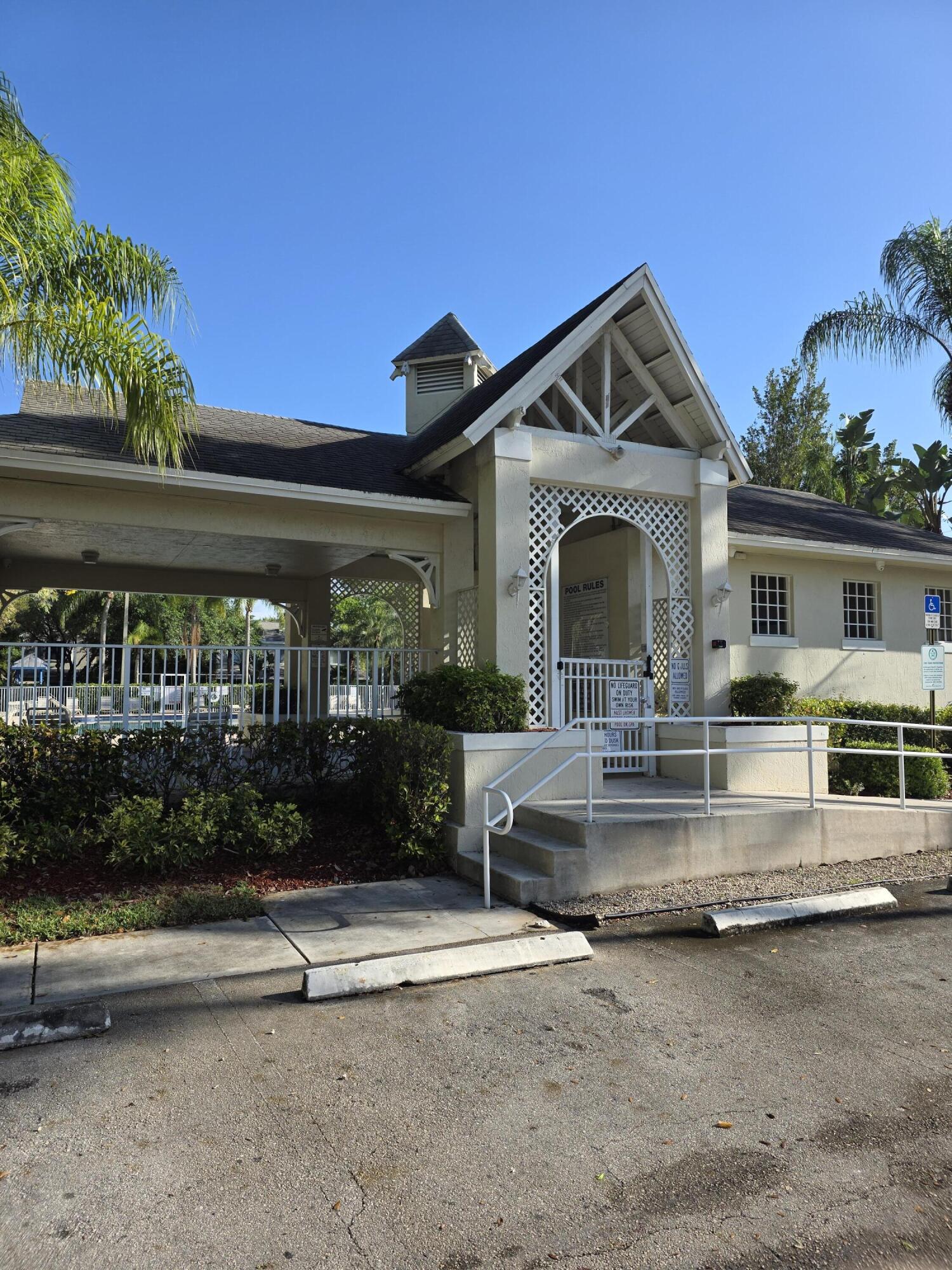 10851 Palm Ridge Lane Tamarac, FL 33321 - Photo 30 of 40 a view of house with outdoor space and sitting area