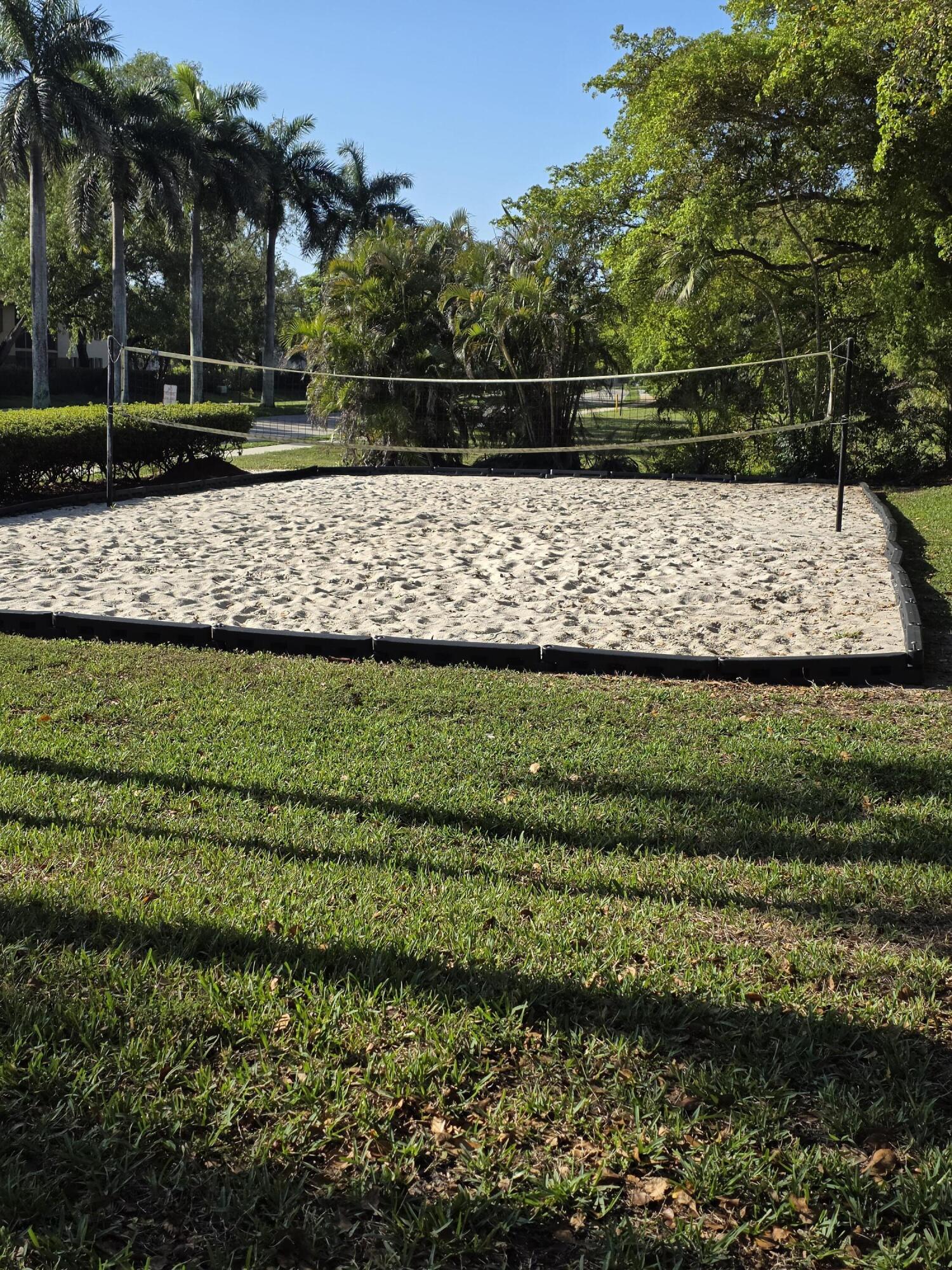10851 Palm Ridge Lane Tamarac, FL 33321 - Photo 35 of 40 a view of a yard with wooden fence