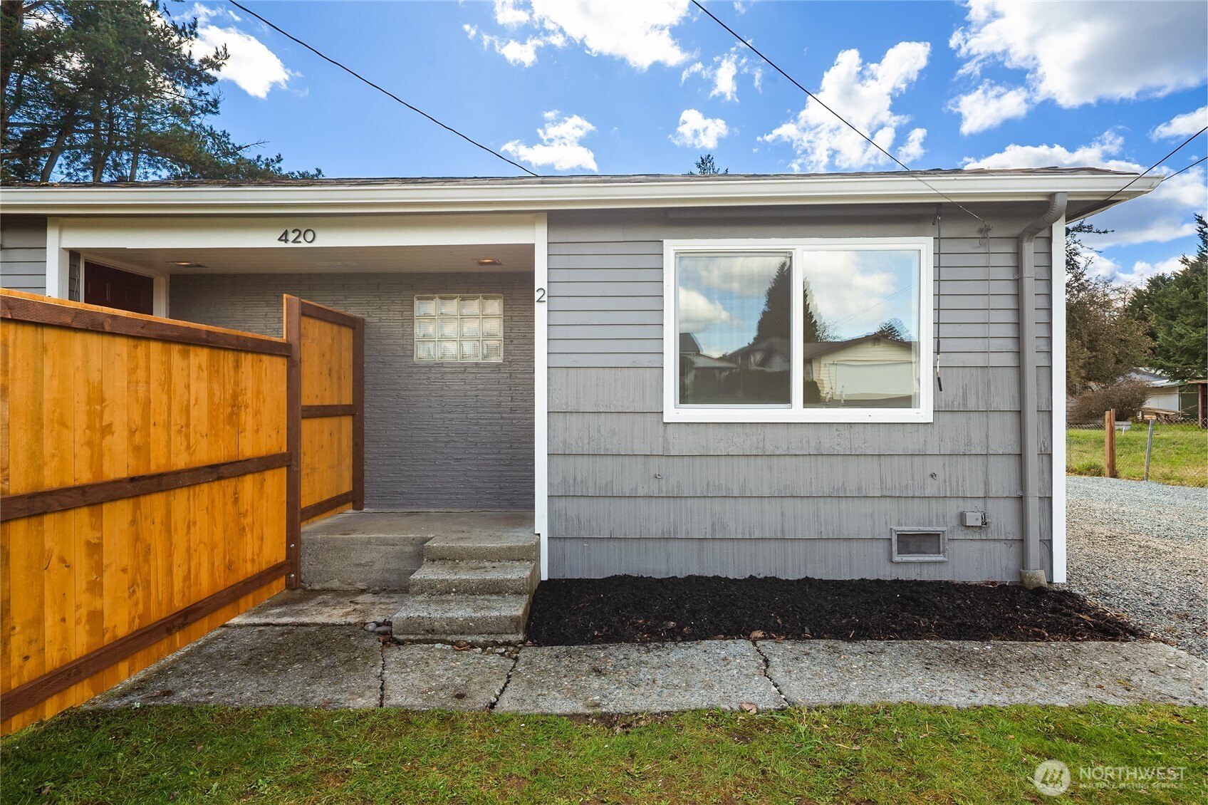420 107th Place Southwest, Unit 2 Everett, WA 98204 - Photo 1 of 13 a front view of a house