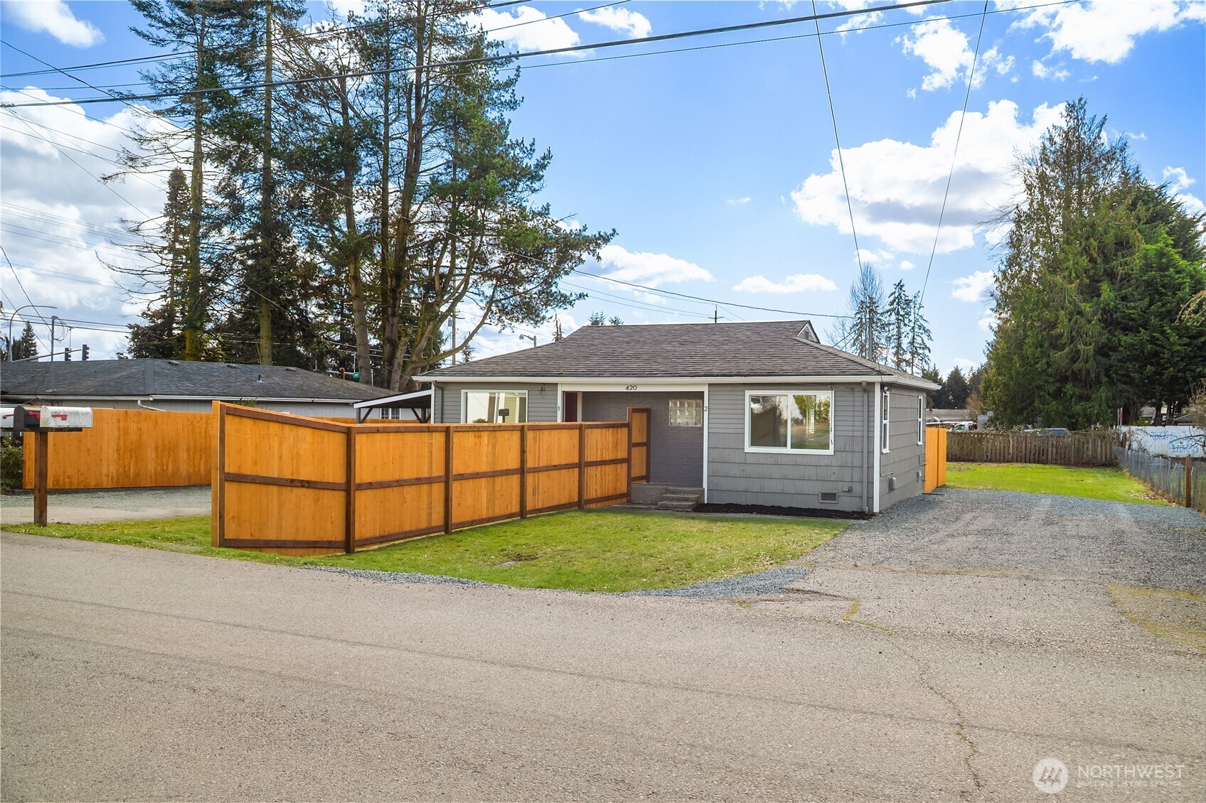 420 107th Place Southwest, Unit 2 Everett, WA 98204 - Photo 13 of 13 a view of a house with a yard and a tub