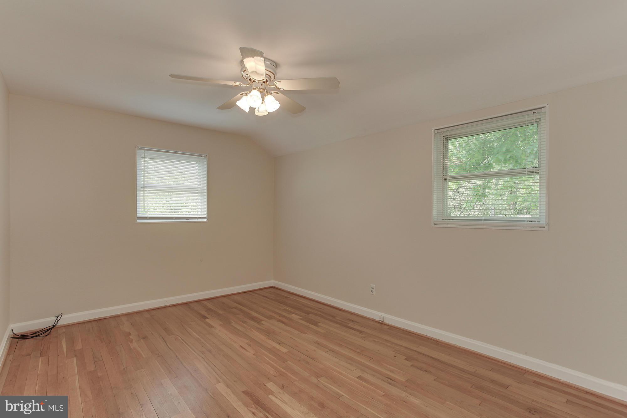 3005 Weisman Road Silver Spring, MD 20902 - Photo 14 of 29 a view of a room that has a window and wooden floor