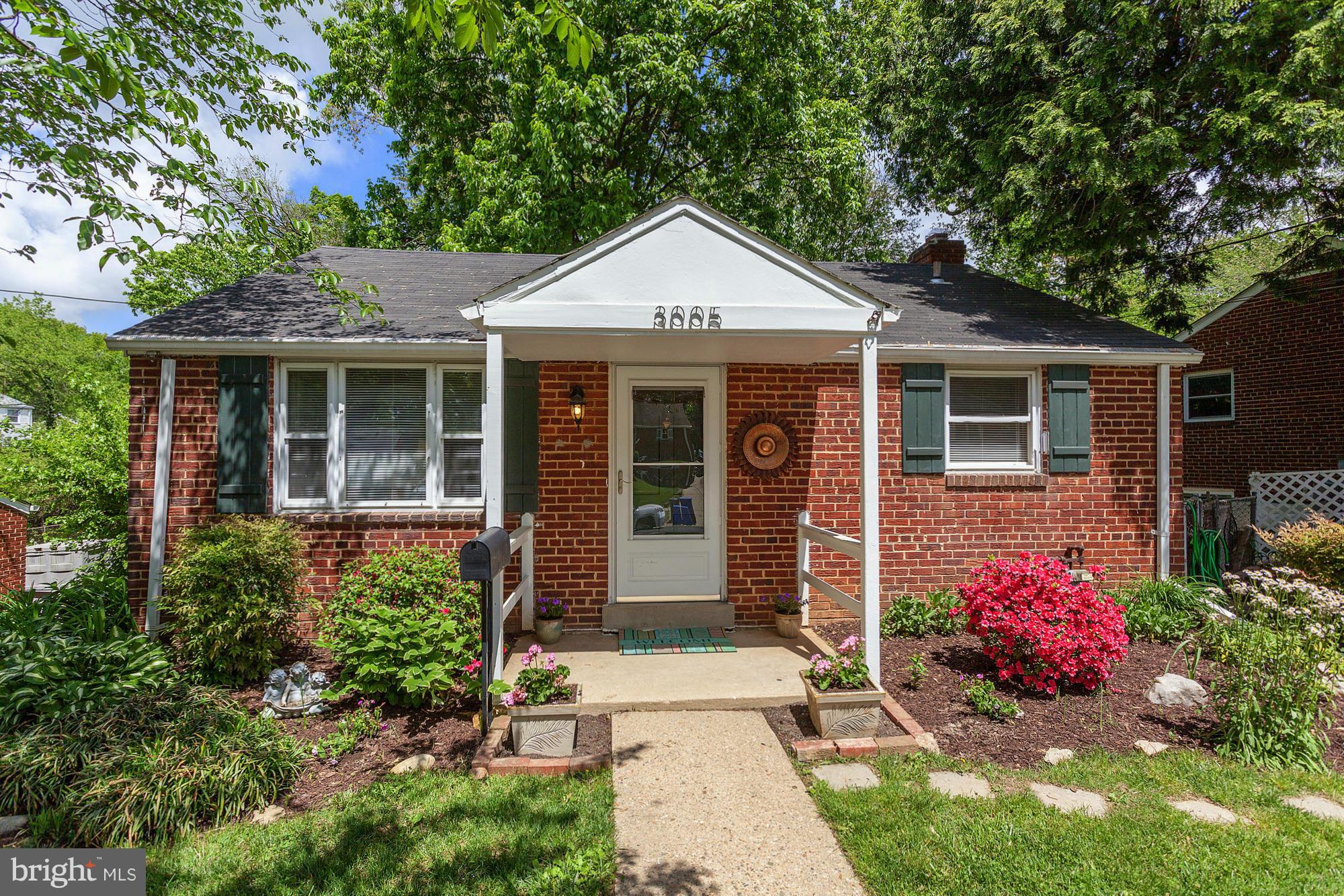 3005 Weisman Road Silver Spring, MD 20902 - Photo 29 of 29 a front view of a house with a yard and potted plants