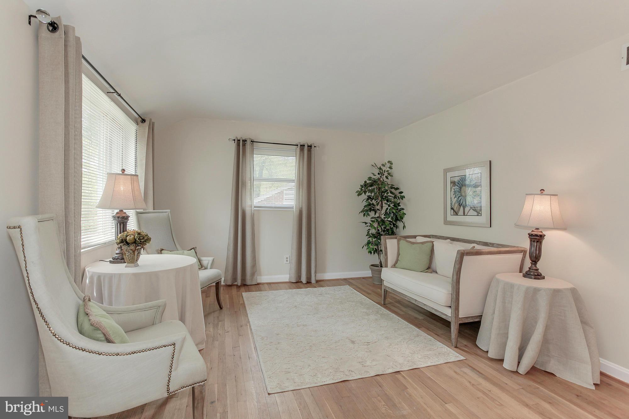 3005 Weisman Road Silver Spring, MD 20902 - Photo 4 of 29 a living room with furniture and a couch