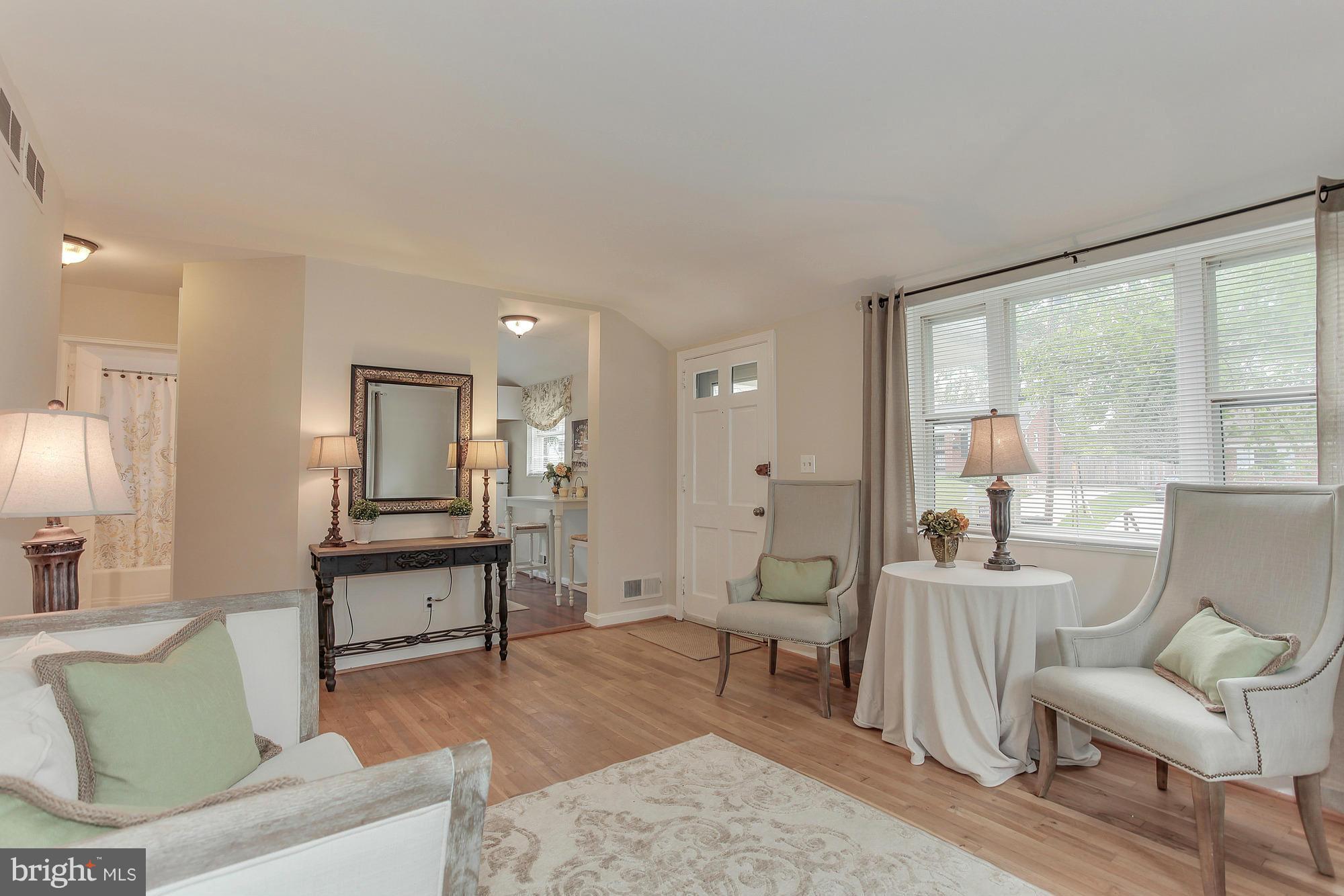 3005 Weisman Road Silver Spring, MD 20902 - Photo 5 of 29 a living room with furniture and a large window