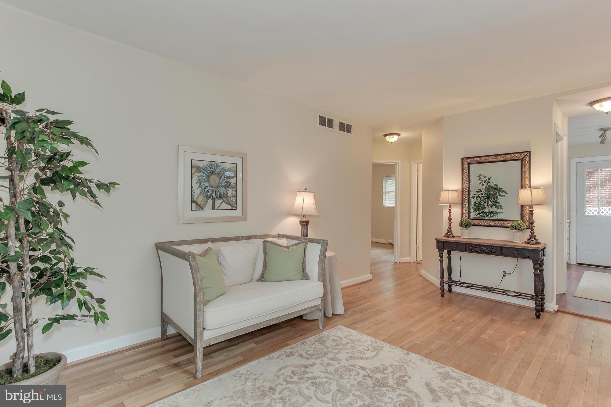 3005 Weisman Road Silver Spring, MD 20902 - Photo 6 of 29 a living room with furniture and a potted plant