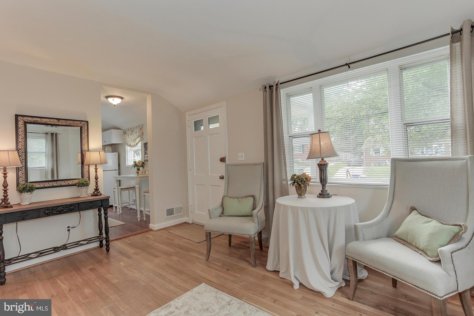 3005 Weisman Road Silver Spring, MD 20902 - Photo 7 of 29 a living room with furniture and a large window