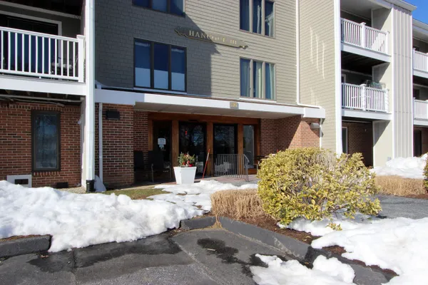 a view of a building with sitting area