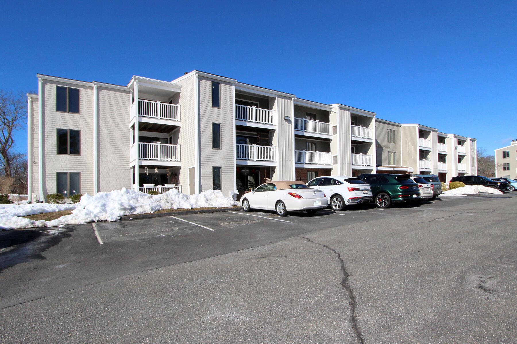 36 Old Colony Way, Unit 21 Orleans, MA 02653 - Photo 2 of 25 a car parked in front of a building