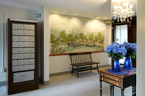 a view of a porch with furniture and a yard