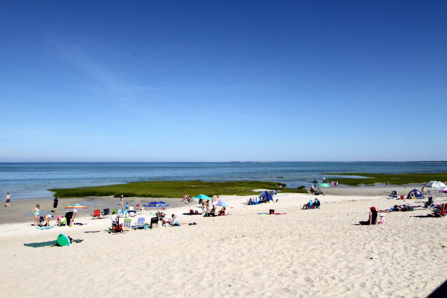 36 Old Colony Way, Unit 21 Orleans, MA 02653 - Photo 24 of 25 a view of a room with water heater and wooden walls