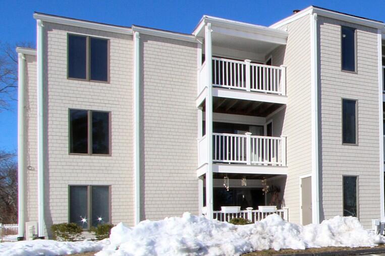 36 Old Colony Way, Unit 21 Orleans, MA 02653 - Photo 3 of 25 a view of a balcony with a chair