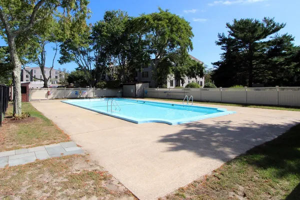 a view of a swimming pool with an outdoor space and seating area
