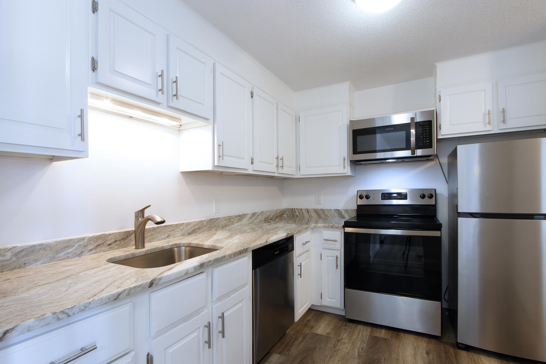 36 Old Colony Way, Unit 21 Orleans, MA 02653 - Photo 5 of 25 a kitchen with appliances a sink and cabinets