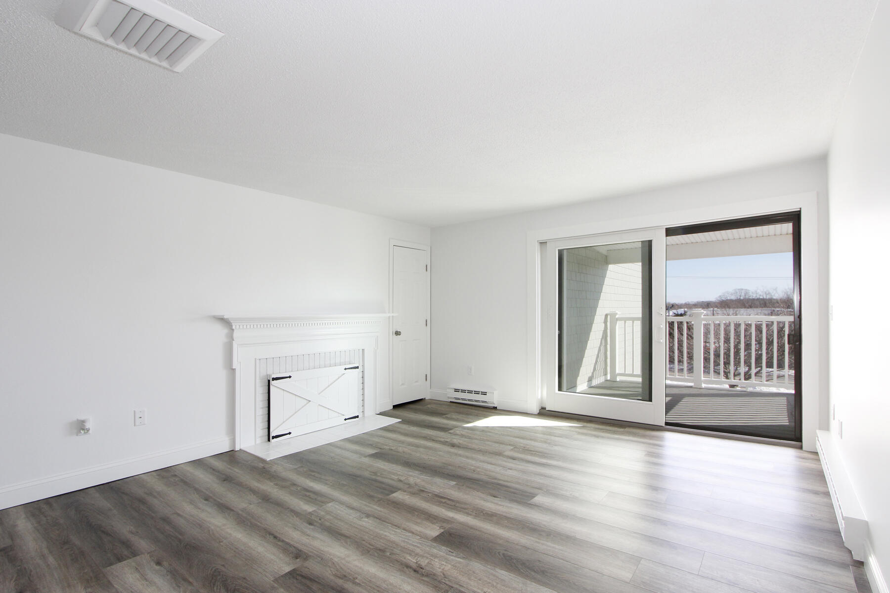 36 Old Colony Way, Unit 21 Orleans, MA 02653 - Photo 7 of 25 a view of empty room with wooden floor and fan