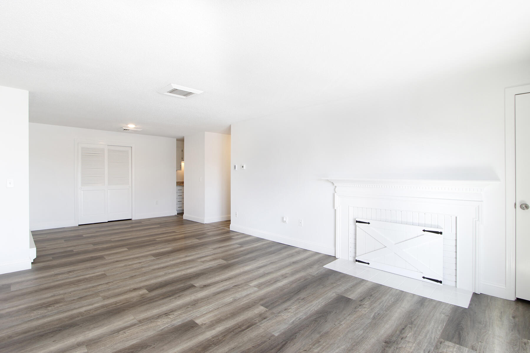 36 Old Colony Way, Unit 21 Orleans, MA 02653 - Photo 10 of 25 a view of empty room with wooden floor
