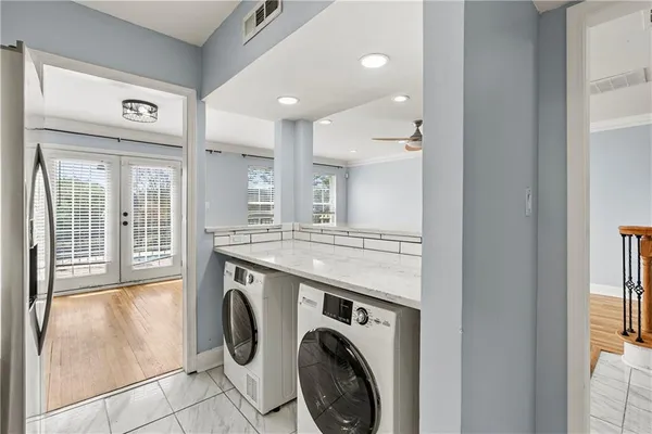 a view of a kitchen with washer and dryer