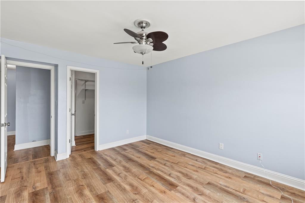 6980 Roswell Road, Unit K4 Atlanta, GA 30328 - Photo 23 of 31 a view of empty room with wooden floor