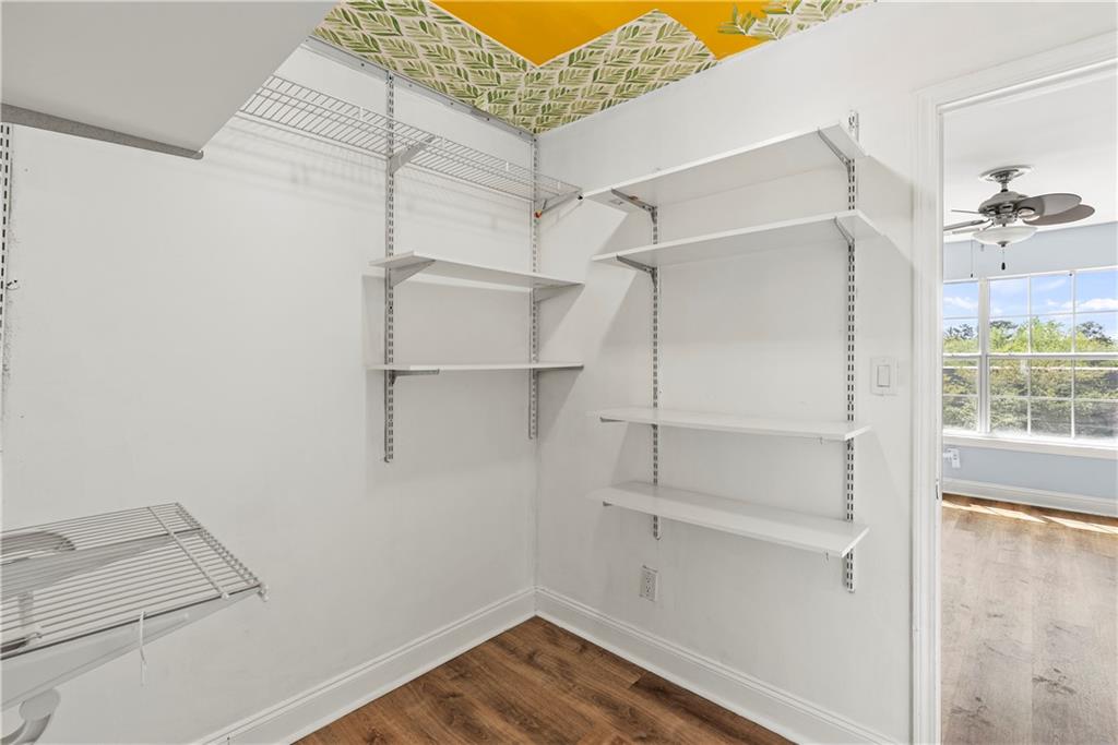 6980 Roswell Road, Unit K4 Atlanta, GA 30328 - Photo 25 of 31 a view of walk in closet with empty racks