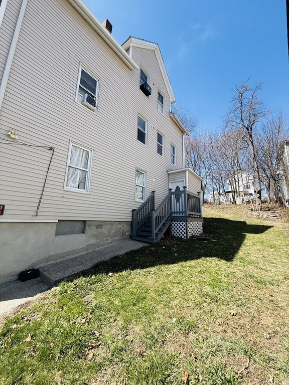26 Edgeworth Street, Unit 1 Worcester, MA 01605 - Photo 12 of 13 a view of backyard of house with outdoor seating
