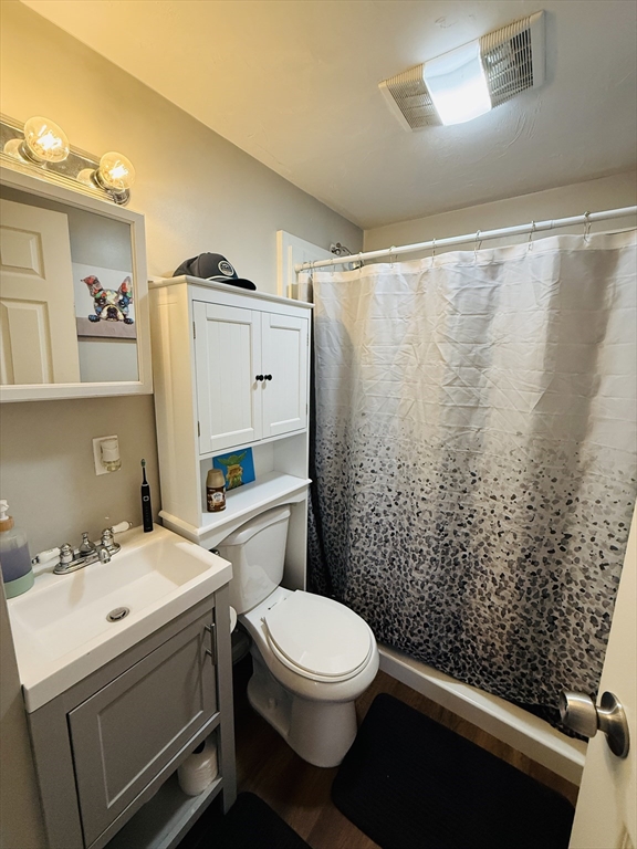 26 Edgeworth Street, Unit 1 Worcester, MA 01605 - Photo 5 of 13 a bathroom with a sink a toilet and shower