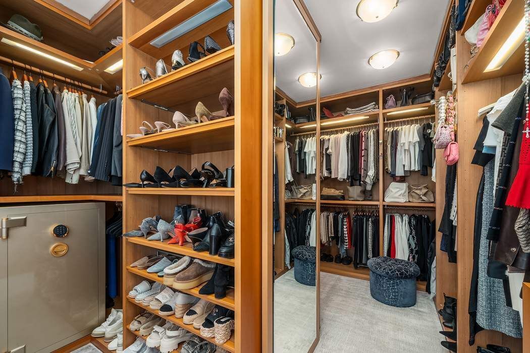 530 East 76th Street, Unit 22CDEG Manhattan, NY 10021 - Photo 15 of 31 a view of walk in closet with clothes and shoes