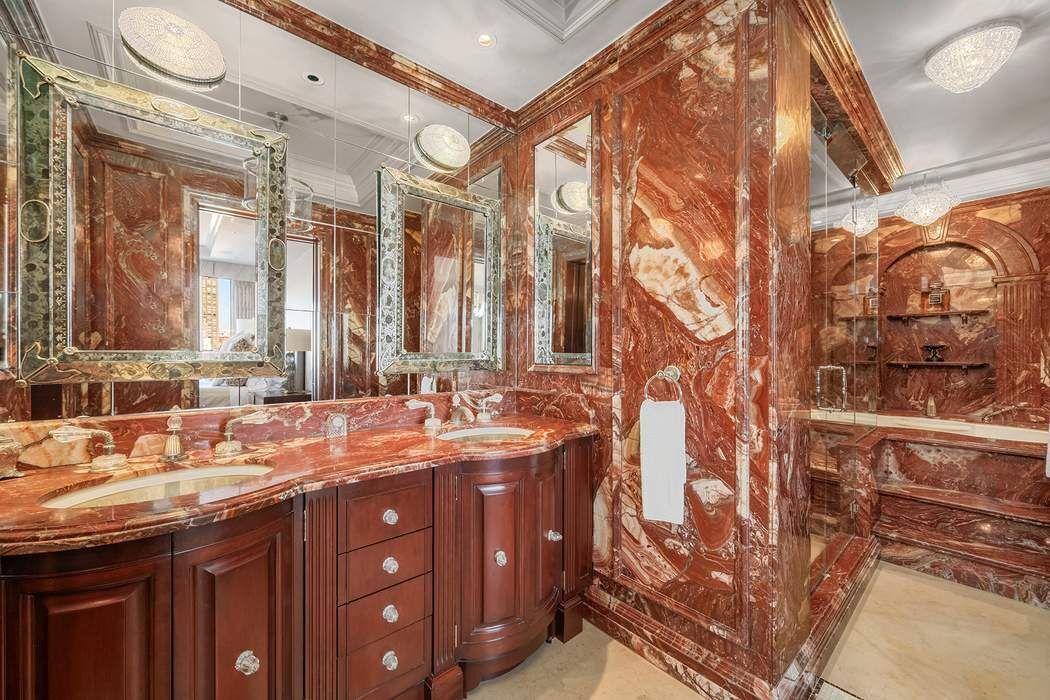 530 East 76th Street, Unit 22CDEG Manhattan, NY 10021 - Photo 16 of 31 a bathroom with a double vanity sink and a mirror