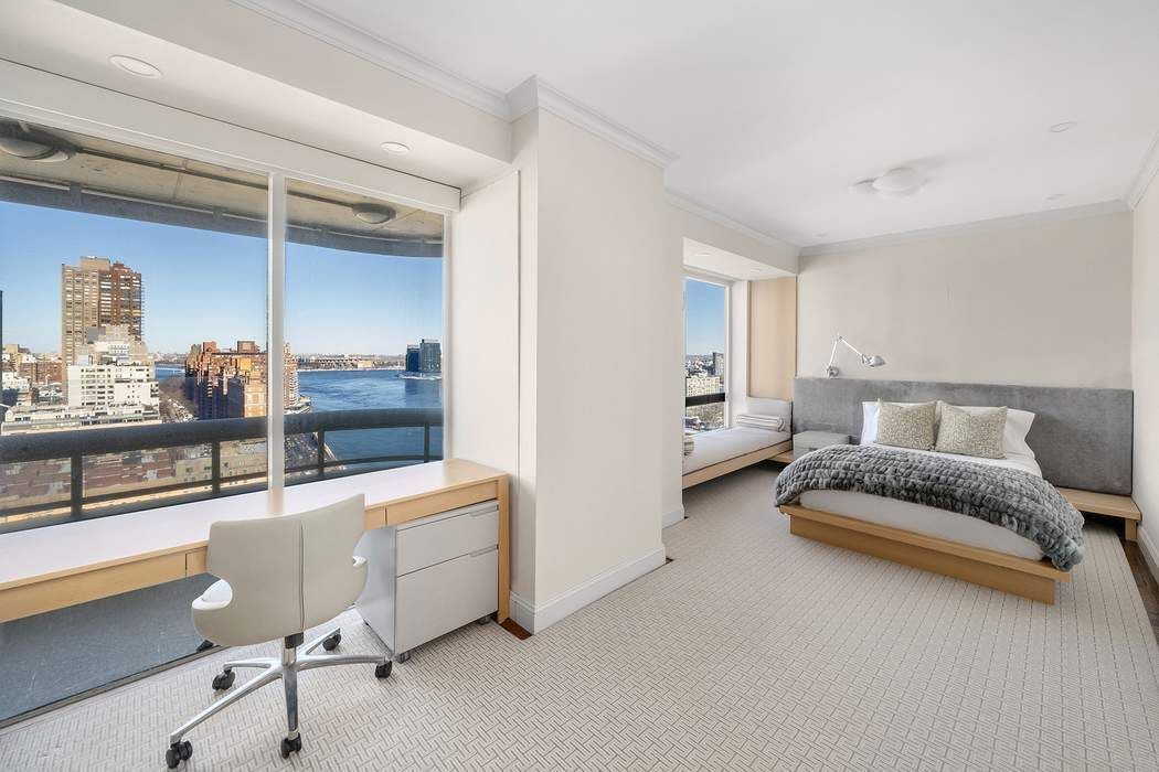 530 East 76th Street, Unit 22CDEG Manhattan, NY 10021 - Photo 19 of 31 a living room with furniture and a window