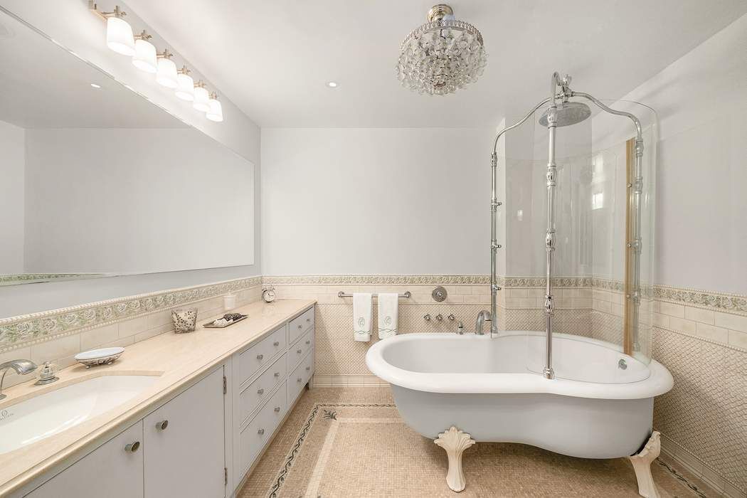 530 East 76th Street, Unit 22CDEG Manhattan, NY 10021 - Photo 22 of 31 a bathroom with a double vanity sink mirror and bathtub