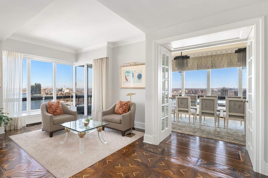 530 East 76th Street, Unit 22CDEG Manhattan, NY 10021 - Photo 3 of 31 a living room with furniture and a wooden floor