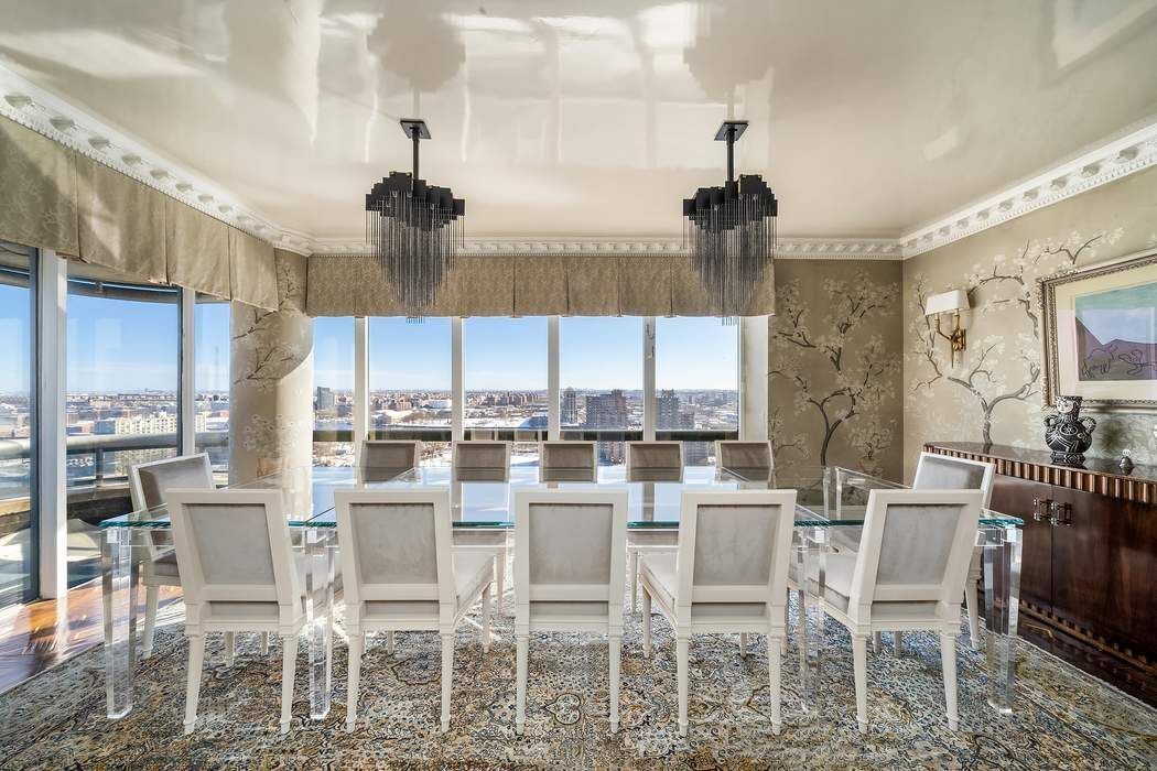530 East 76th Street, Unit 22CDEG Manhattan, NY 10021 - Photo 4 of 31 a dining room with furniture a chandelier and window