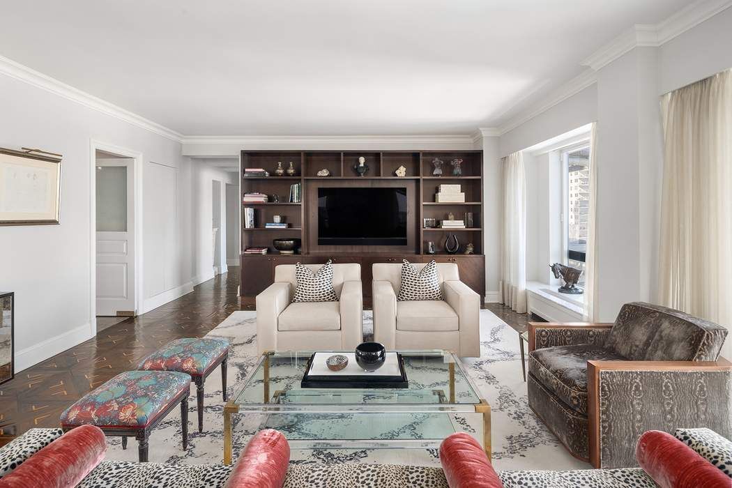 530 East 76th Street, Unit 22CDEG Manhattan, NY 10021 - Photo 6 of 31 a living room with furniture a rug and a flat screen tv