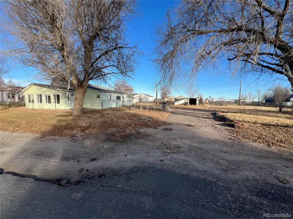 a view of a street with a building in the background