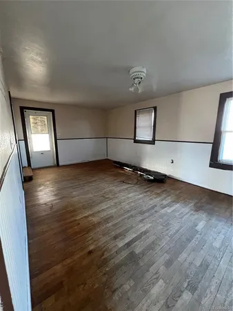 a view of a livingroom with wooden floor