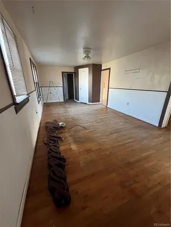a view of a livingroom with wooden floor
