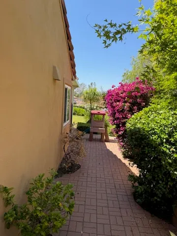 a view of a backyard with a garden