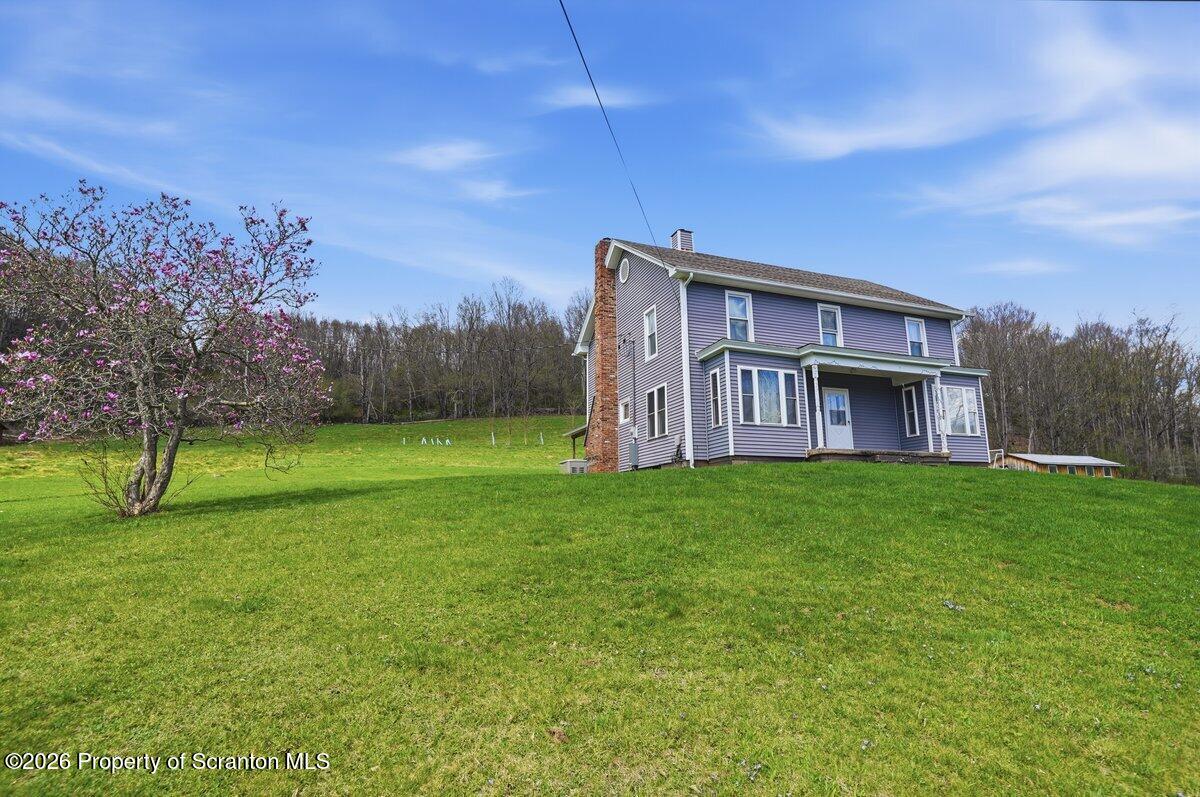 795 Wescott Road New Milford, PA 18834 - Photo 1 of 81 a view of a house with a backyard