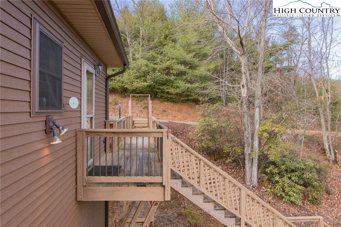 4091 Staghorn Road Purlear, NC 28665 - Photo 18 of 47 a view of a balcony with two chairs