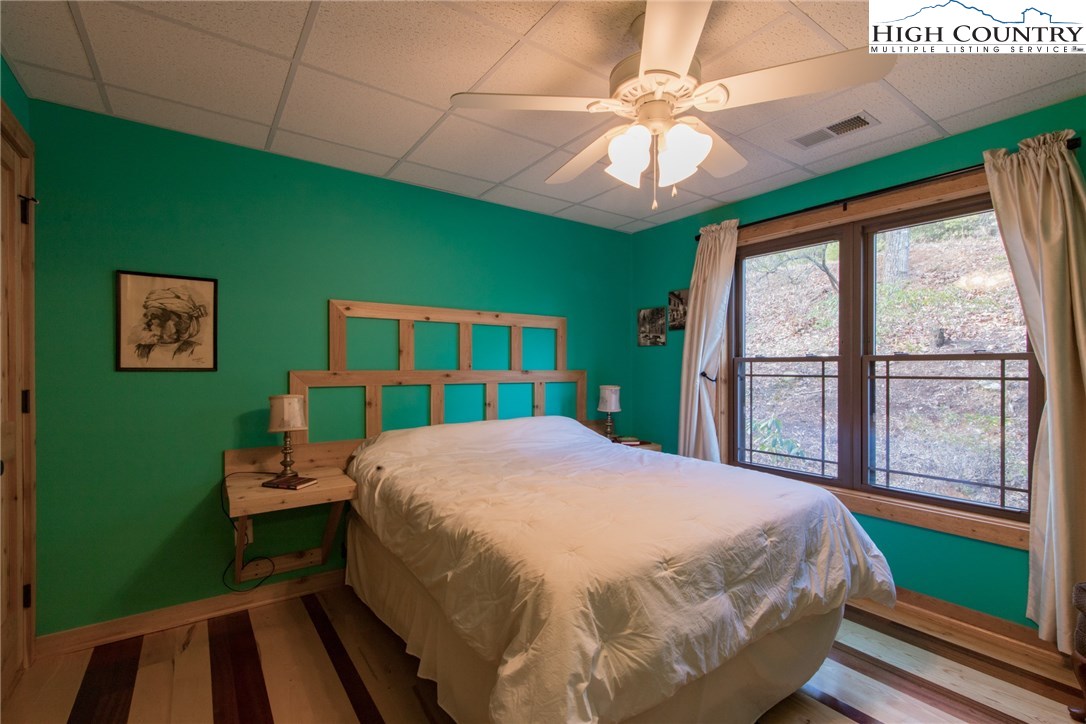 4091 Staghorn Road Purlear, NC 28665 - Photo 31 of 47 a bedroom with a bed and a large window