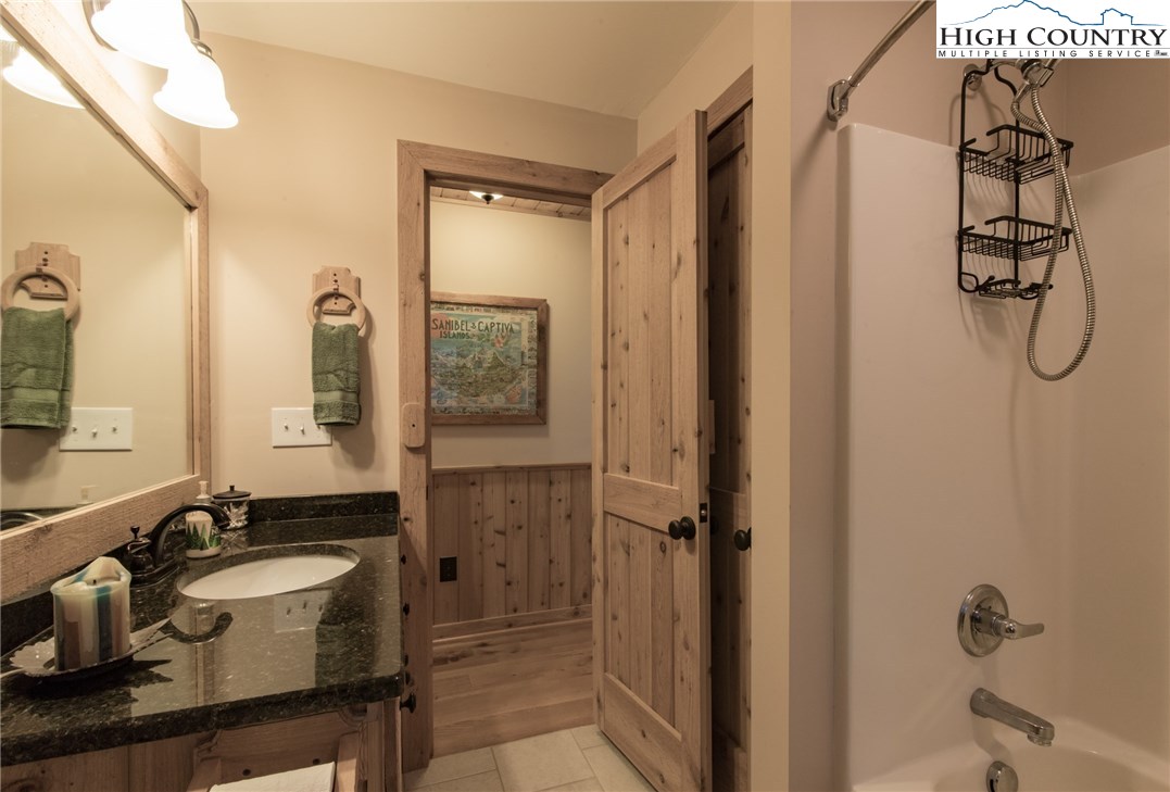 4091 Staghorn Road Purlear, NC 28665 - Photo 34 of 47 a bathroom with a sink and a mirror