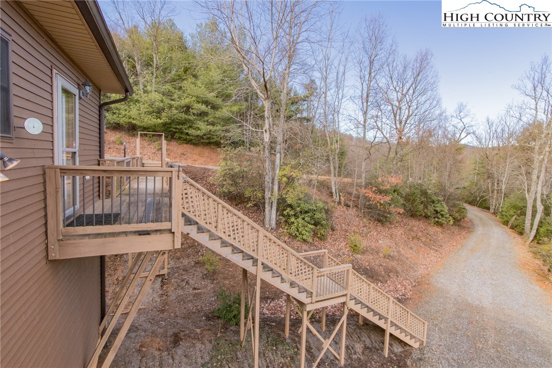 4091 Staghorn Road Purlear, NC 28665 - Photo 41 of 47 a view of balcony with wooden fence and trees