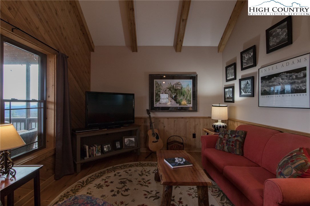 4091 Staghorn Road Purlear, NC 28665 - Photo 10 of 47 a living room with furniture and a flat screen tv