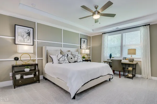 a bedroom with a bed and a table