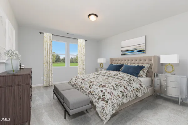 a bedroom with a bed and a couch