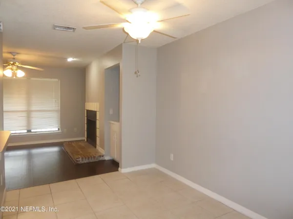 a view of a hallway with a window