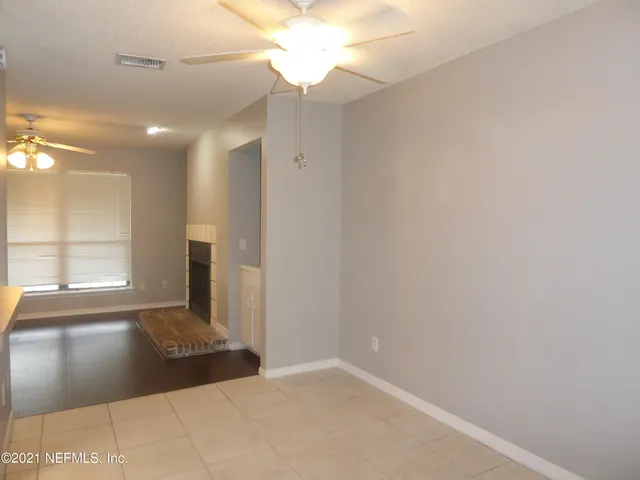 a view of a hallway with a window